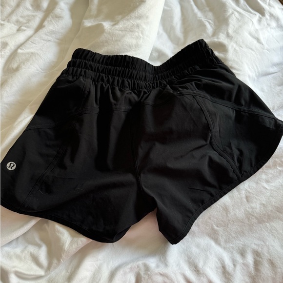 Black lululemon track that shorts size 4 - Picture 3 of 3